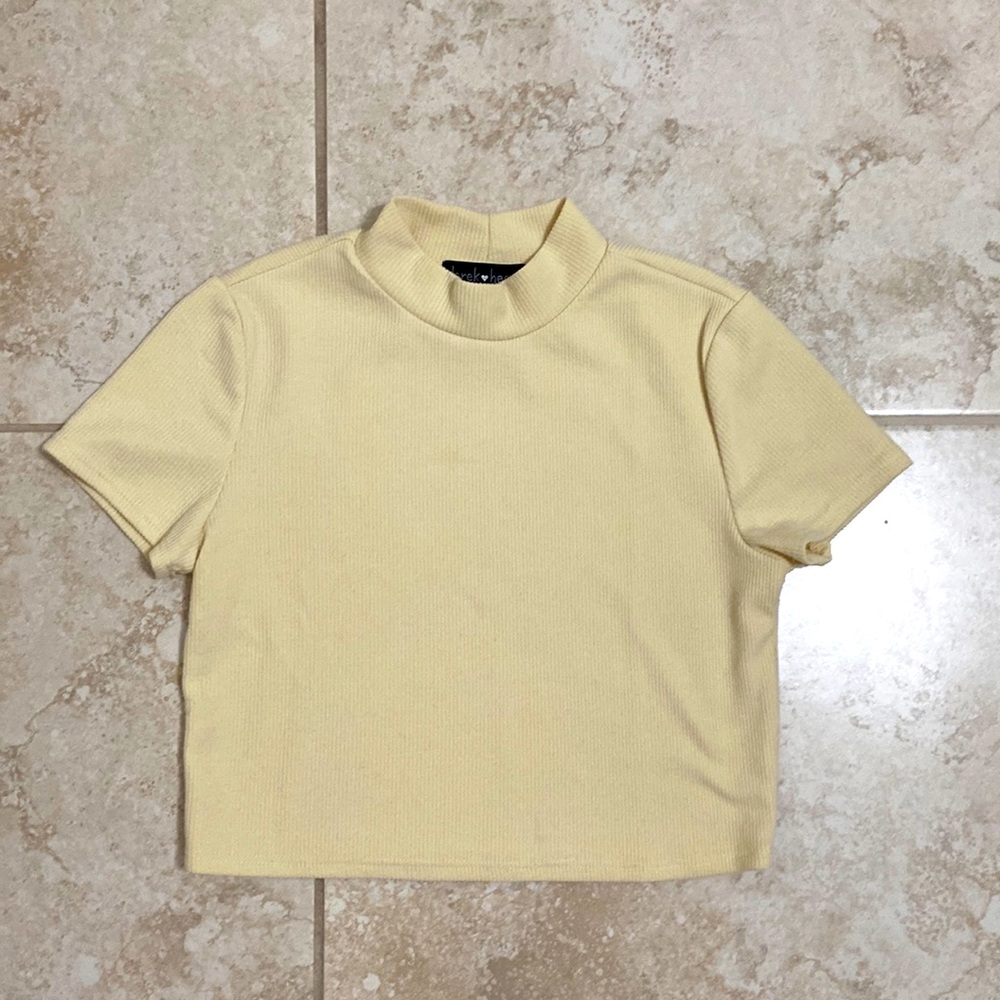 Light yellow crop top with a high neck